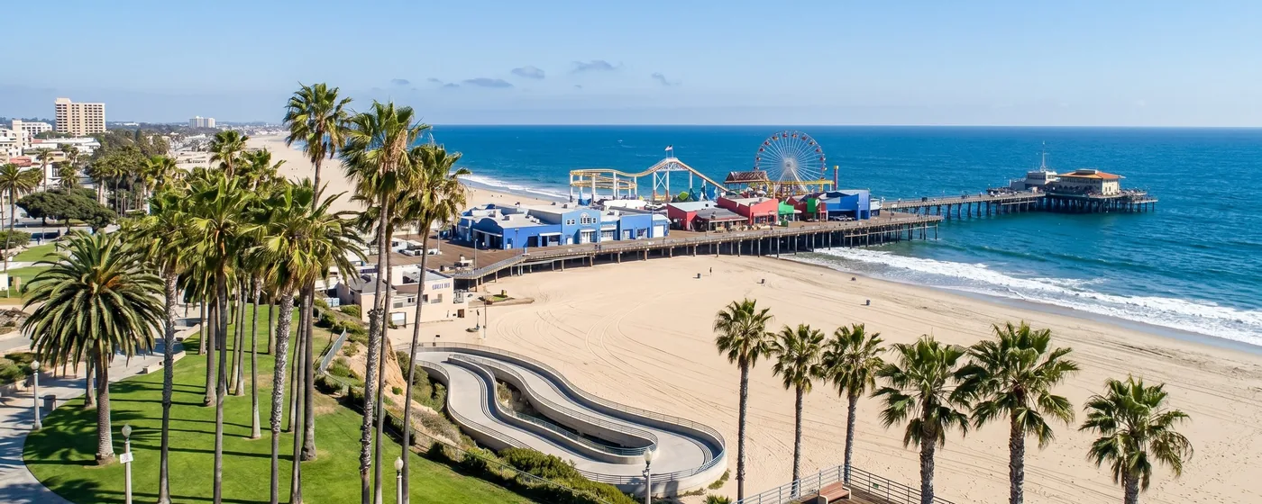 Buy a home in Santa Monica CA — get 1% cash back at closing Santa Monica pier and boardwalk with palm trees and Pacific Ocean — Portfolio Home Realty buyer agent